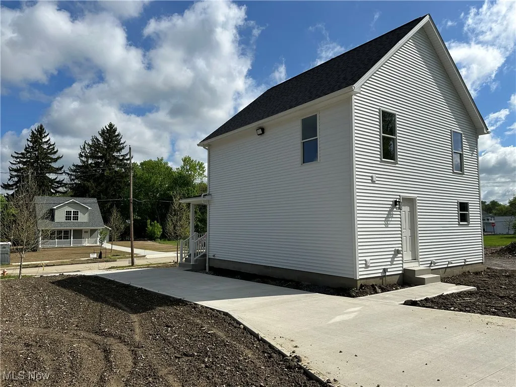 View of home's exterior with entry steps
