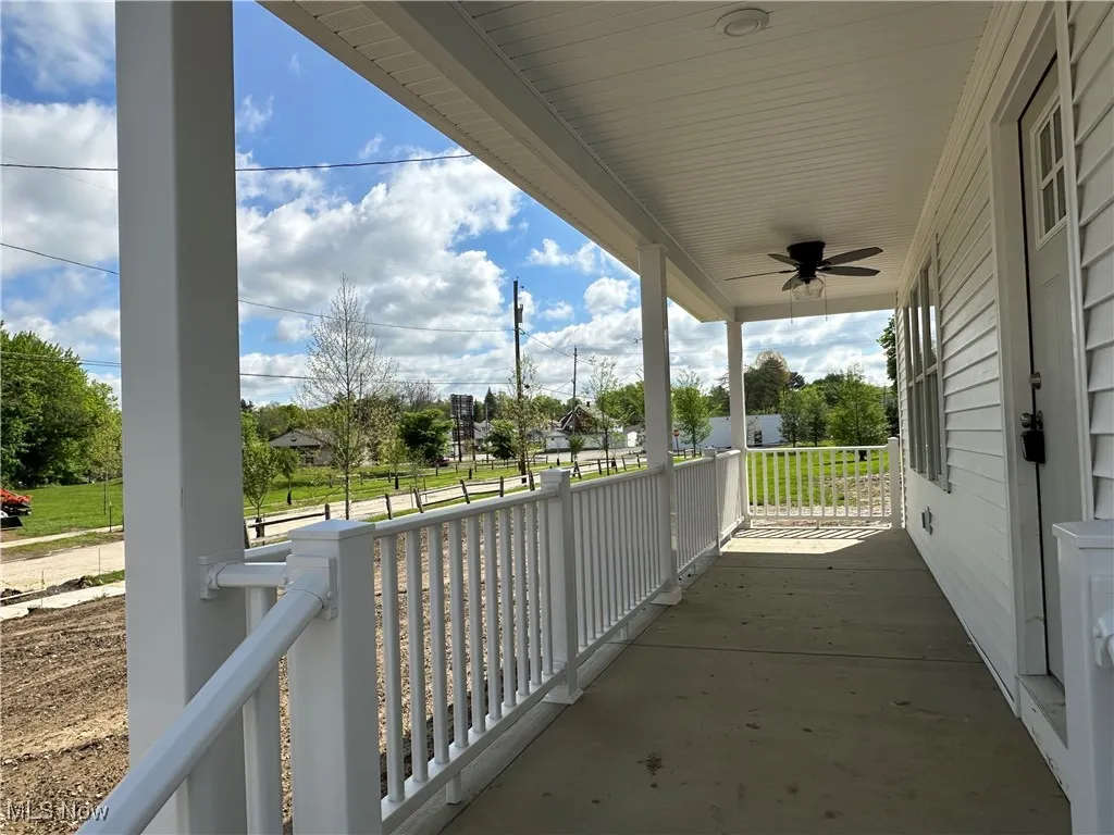 Covered front porch with ceiling fan