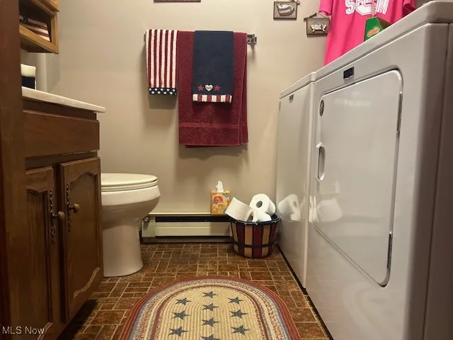Bathroom with Laundry located on first floor just inside the rear entrance.