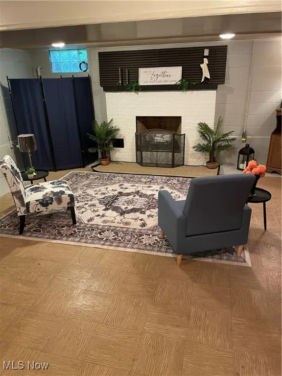 Living area featuring a fireplace in basement