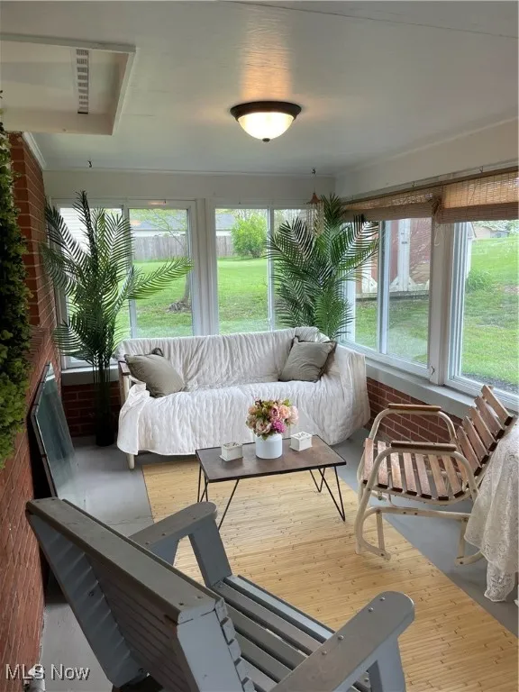 Sunroom / solarium featuring healthy amount of natural light