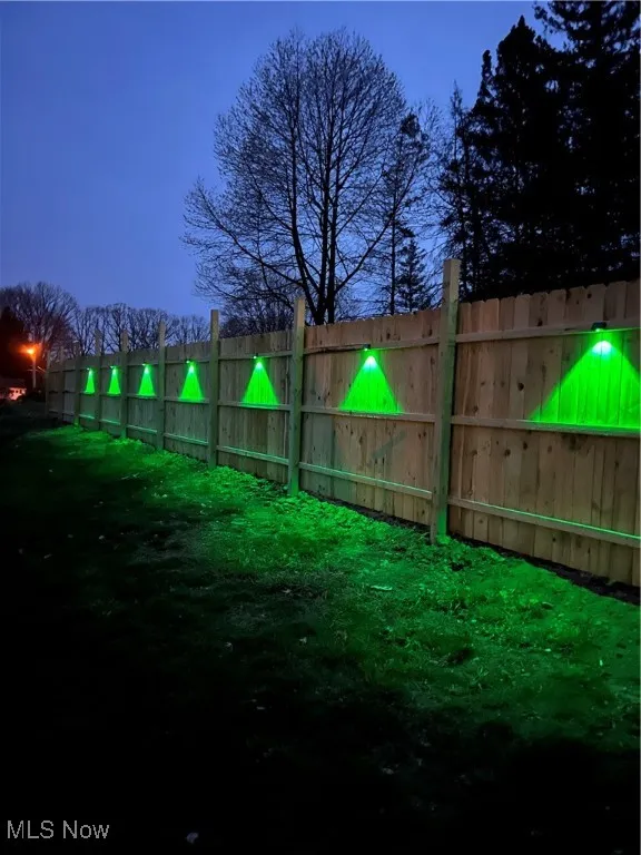 View of yard featuring fence