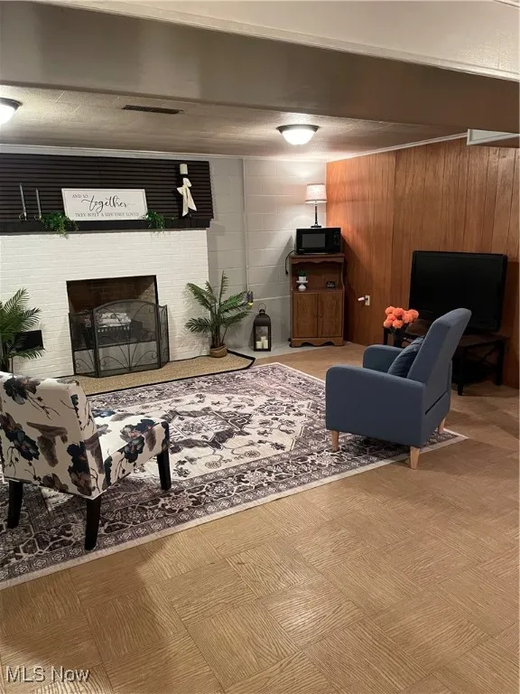 Living room with a brick fireplace