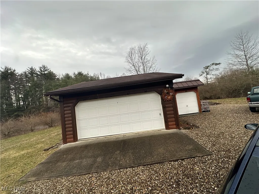 View of 2 car garage with garage door.