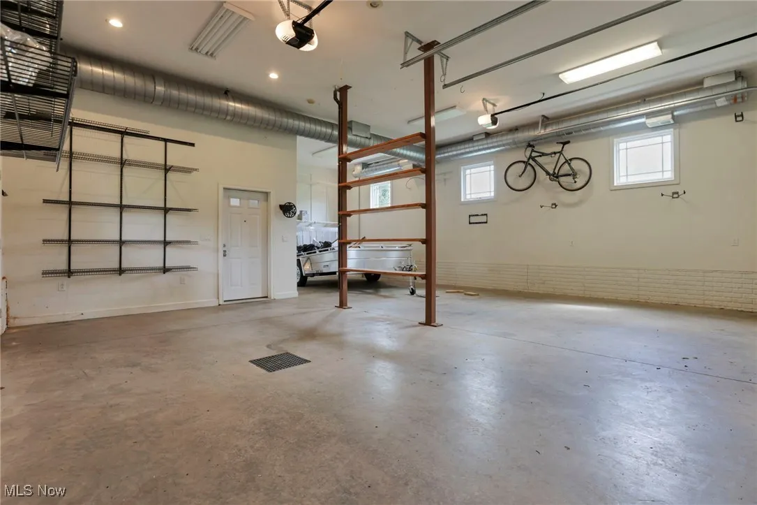 Garage featuring a garage door opener
