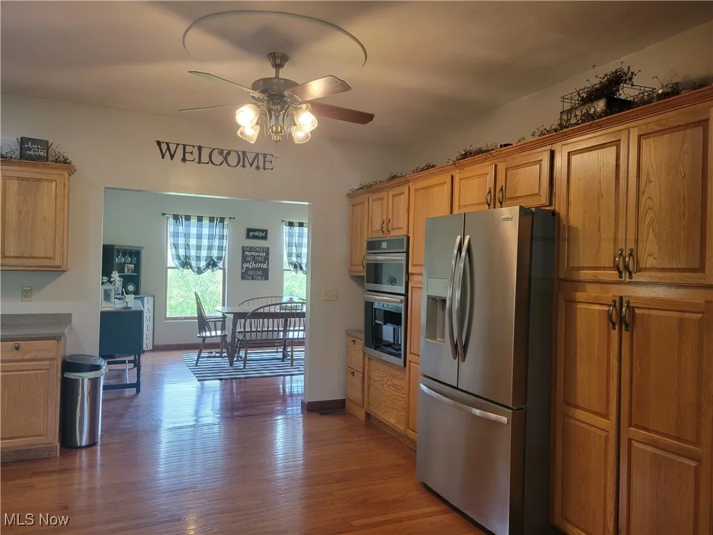 Large kitchen with cabinets and appliances