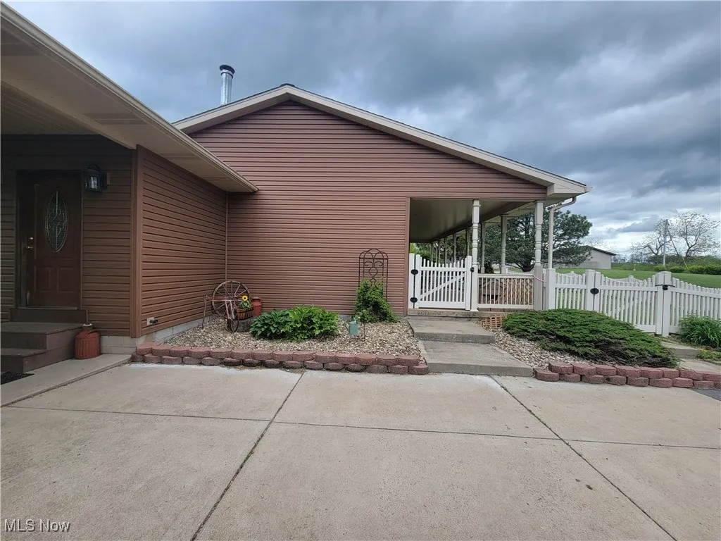 Side view of house and paved drive