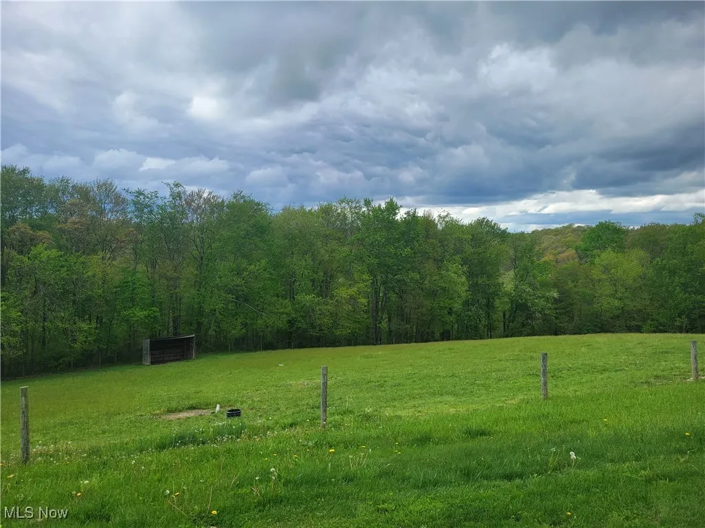 fenced pasture and shed