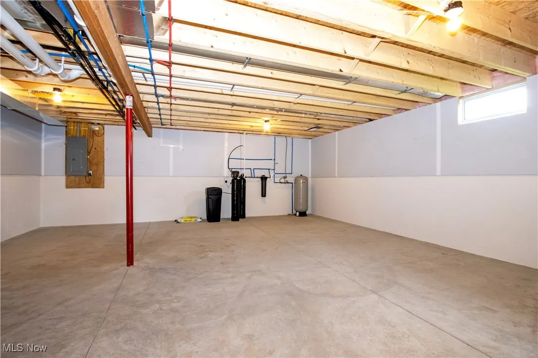Basement featuring electric panel