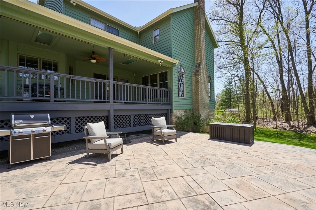 View of patio / terrace with ceiling fan and area for grilling
