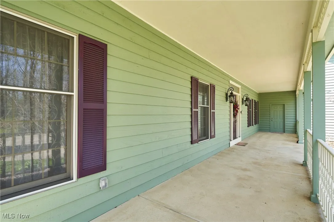 View of patio featuring a porch