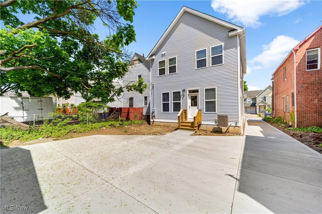 Rear view of property with fence