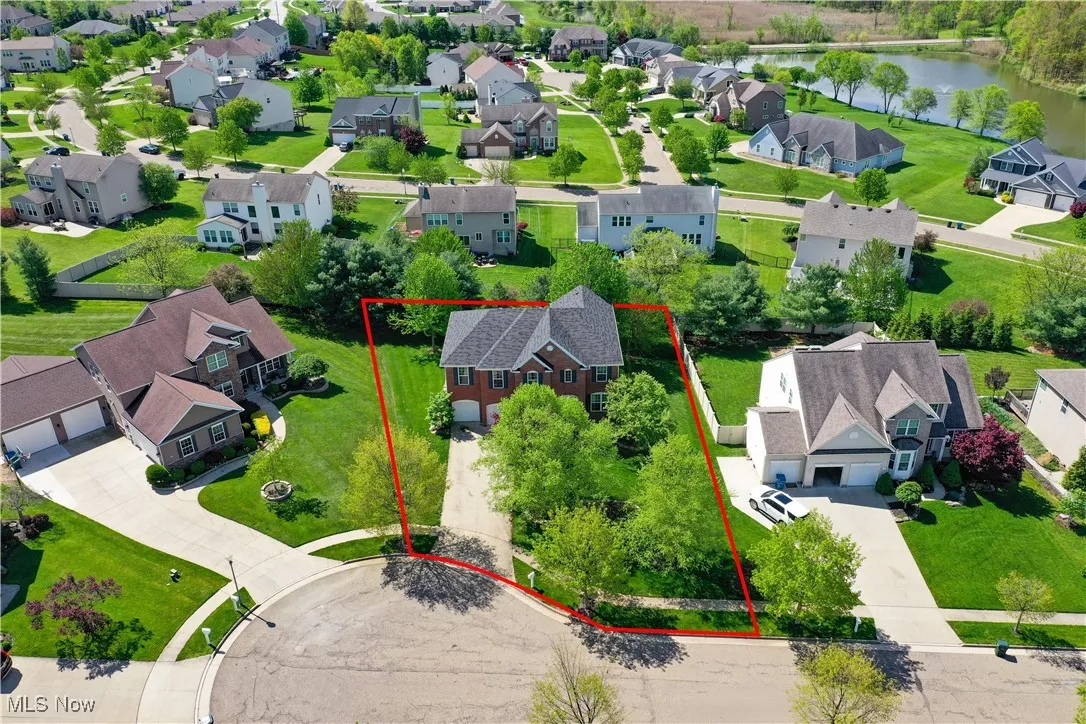 Bird's eye view with a water view and a residential view