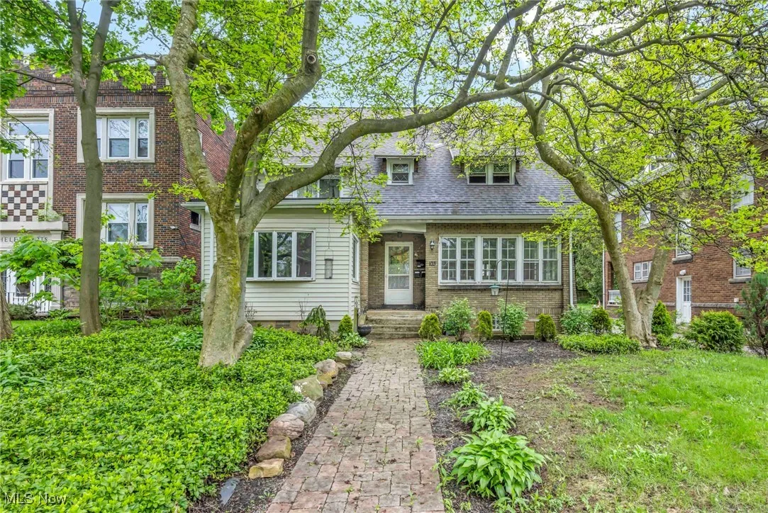 View of front of home featuring brick siding