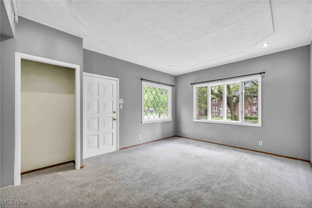Unfurnished bedroom with baseboards, a textured ceiling, carpet flooring, and recessed lighting