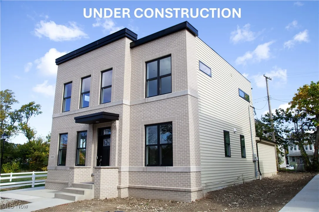 View of front of home featuring brick siding