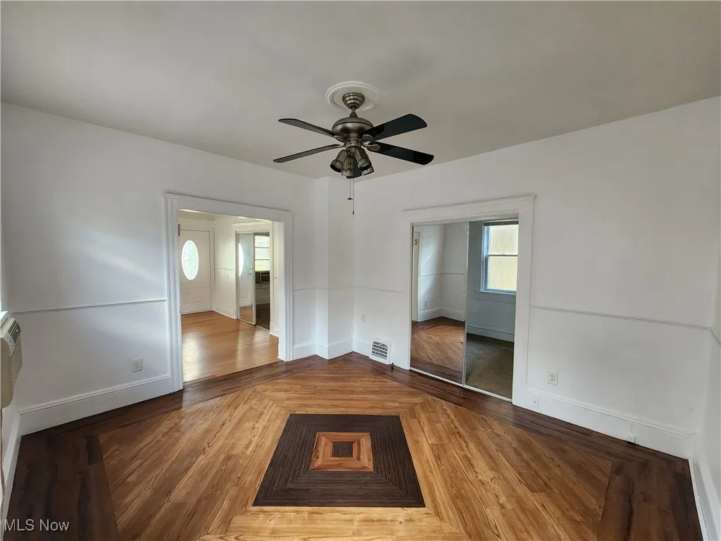 Unfurnished bedroom with baseboards and ceiling fan