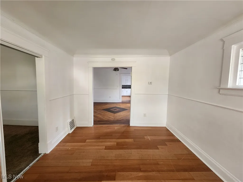 Hallway with wood finished floors