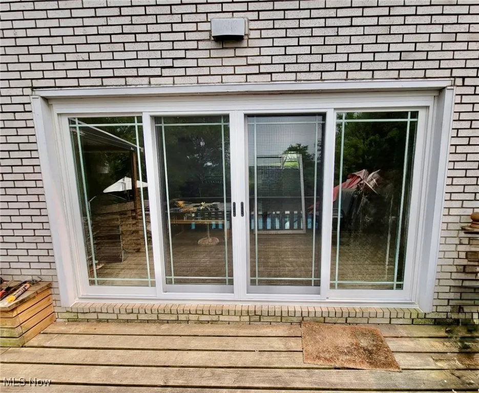 Deck entrance with brick siding