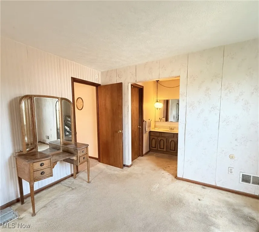 Master Bedroom featuring ensuite area