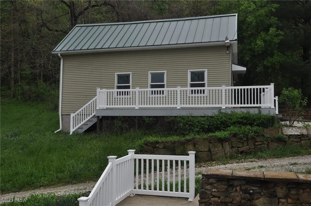 Bungalow with living room/kitchen, two bedrooms, 1 bath, laundry hookup, second level could be finished living area.