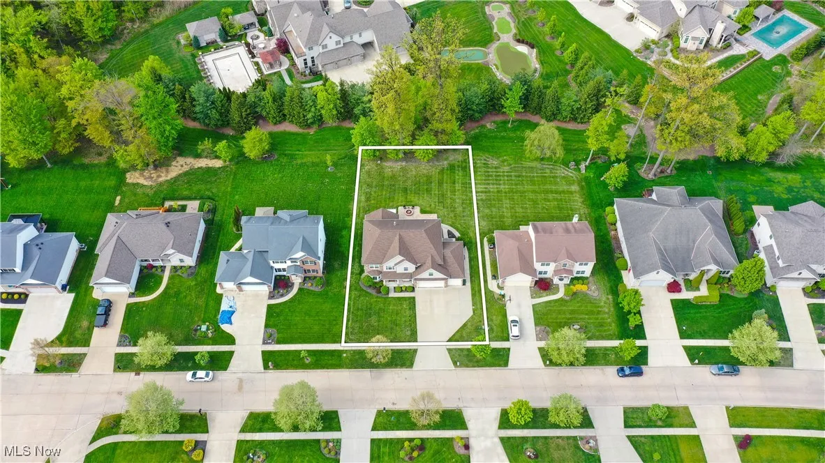 Aerial perspective of suburban area with property boundaries highlighted