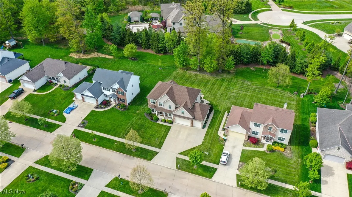 View of property location with nearby suburban area