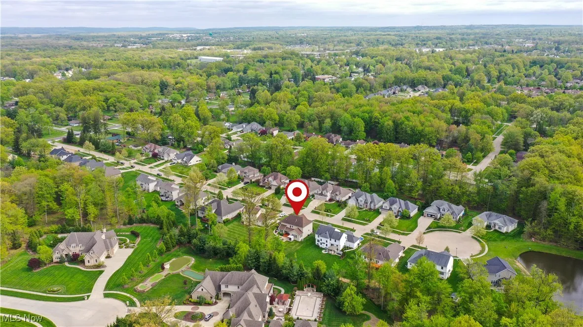 Aerial view of residential area with a heavily wooded area