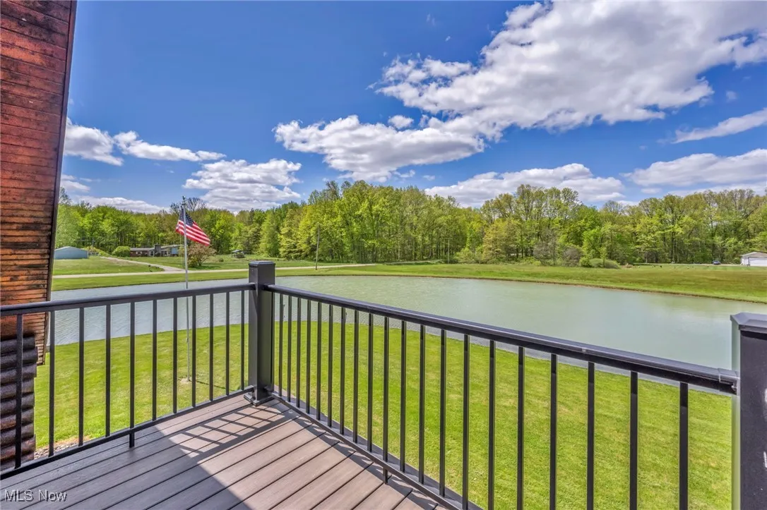 Deck View with a water view and a lawn