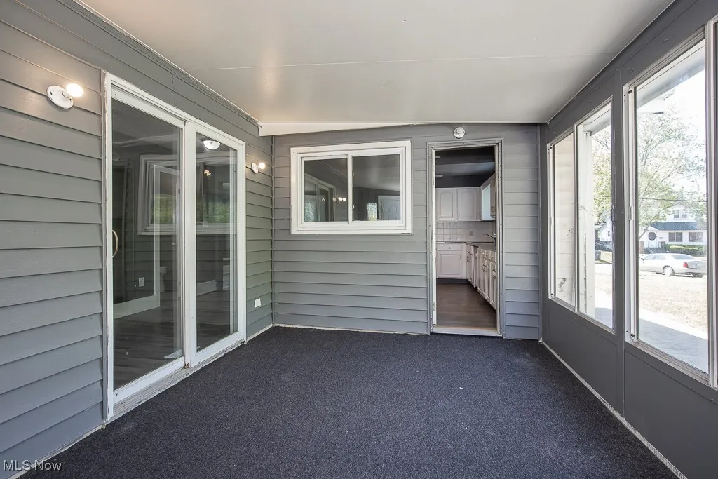 Unfurnished sunroom with plenty of natural light