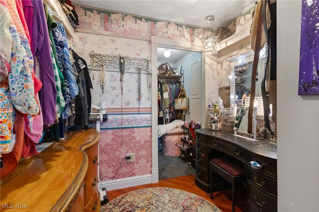 Spacious closet with wood finished floors