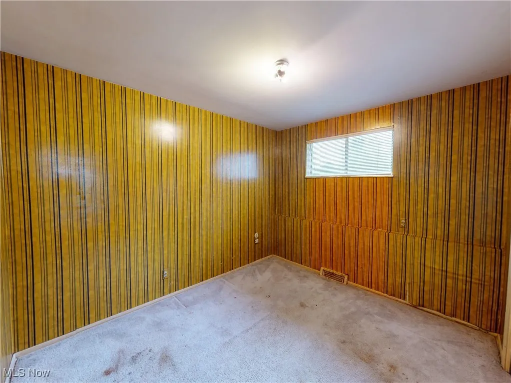 Spare room featuring carpet floors