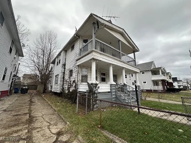 View of front of house featuring a balcony and covered porch