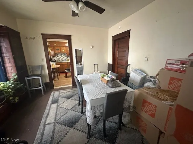 Dining area featuring a ceiling fan and wood finished floors