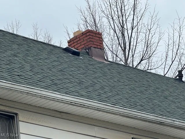 Exterior view of a shingled roof and gutters