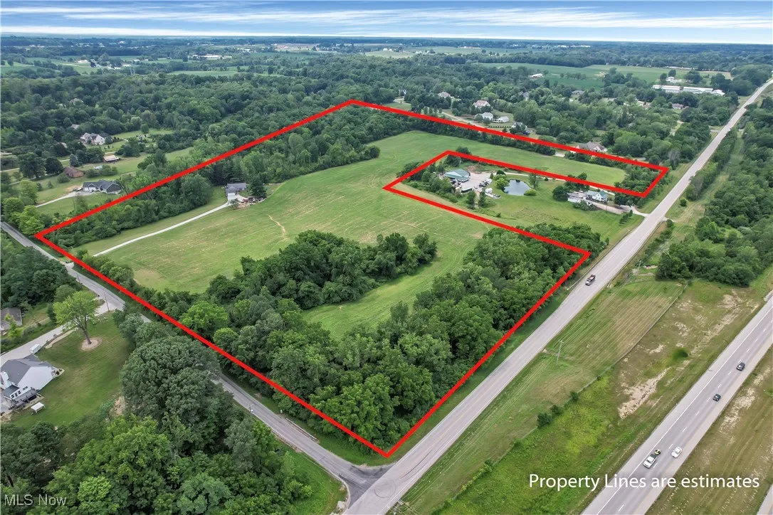 Birds eye view of property with a rural view