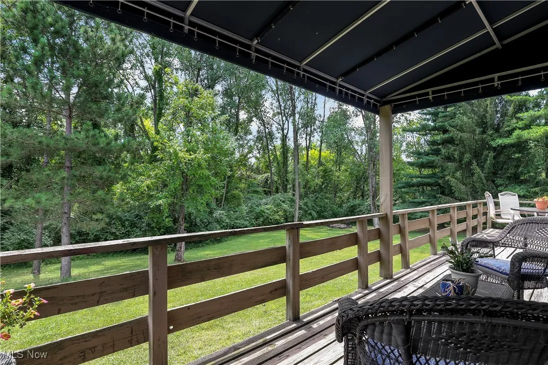 Wooden terrace with a lawn