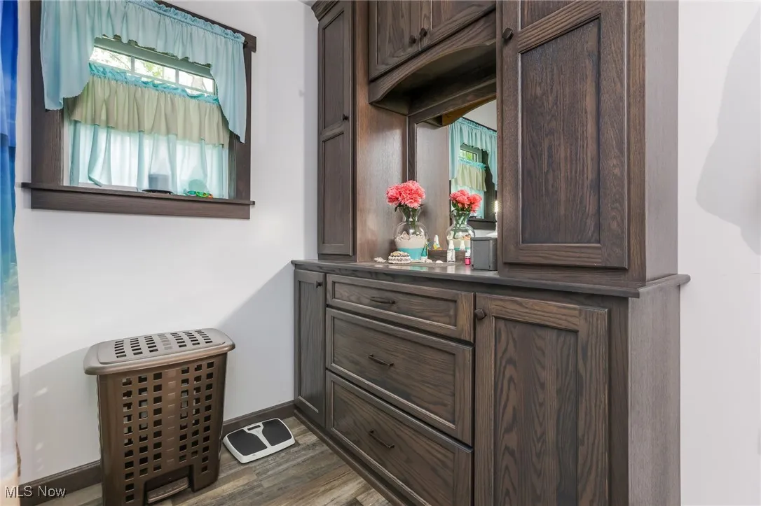 Detailed view of wood finished floors and baseboards