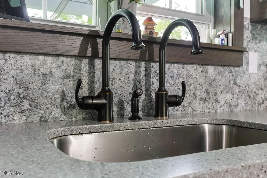 Detailed view of a sink and backsplash