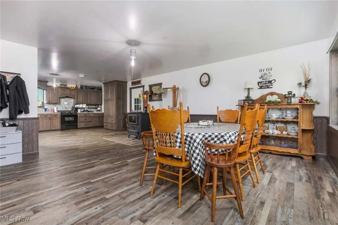 Dining area with dark wood finished floors