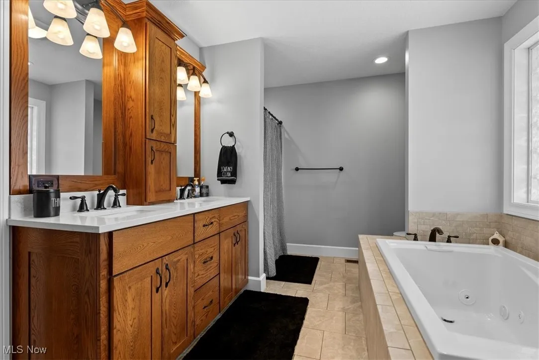 Full bath in the 1st floor bedroom also includes a large walk-in closet