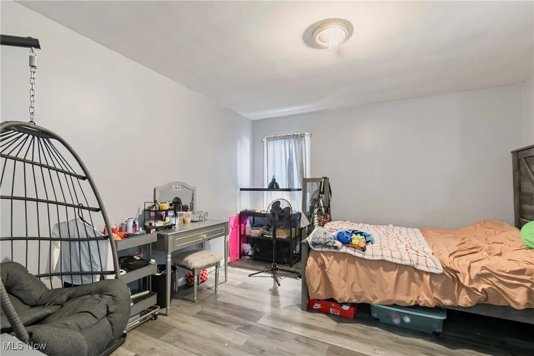 Bedroom with wood finished floors