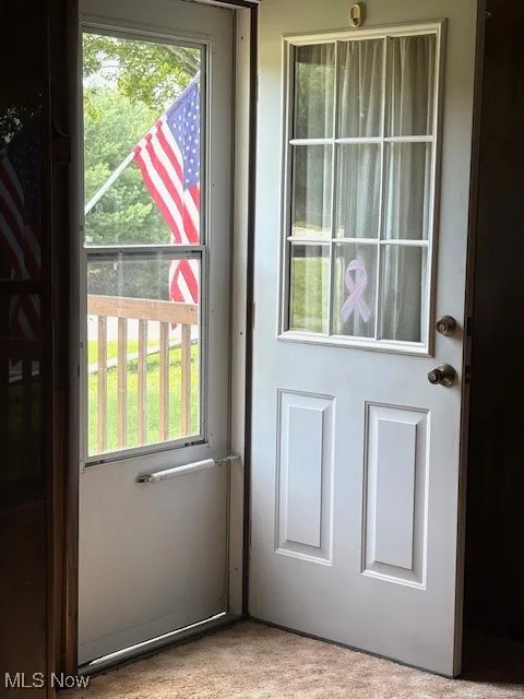 View from Livingroom to front open door
