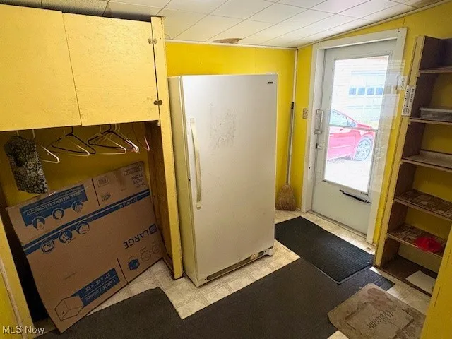 Doorway to outside with tile patterned floors