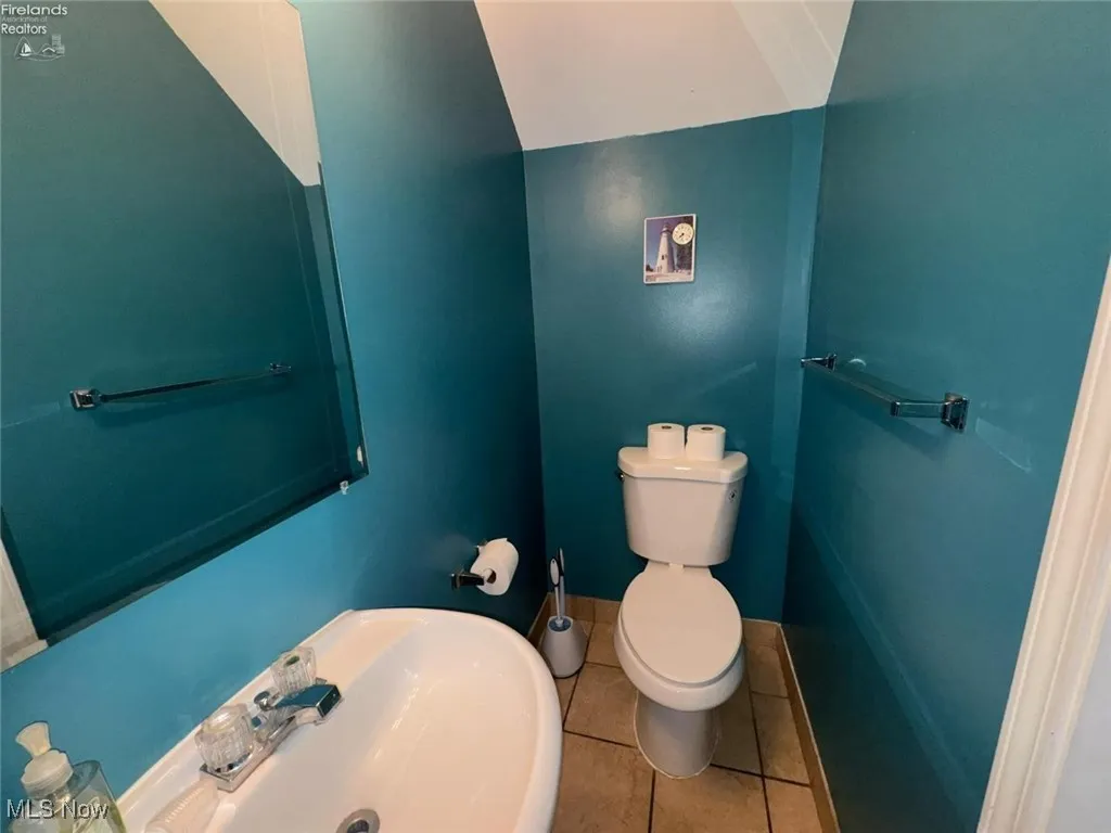 Bathroom featuring tile patterned flooring and toilet