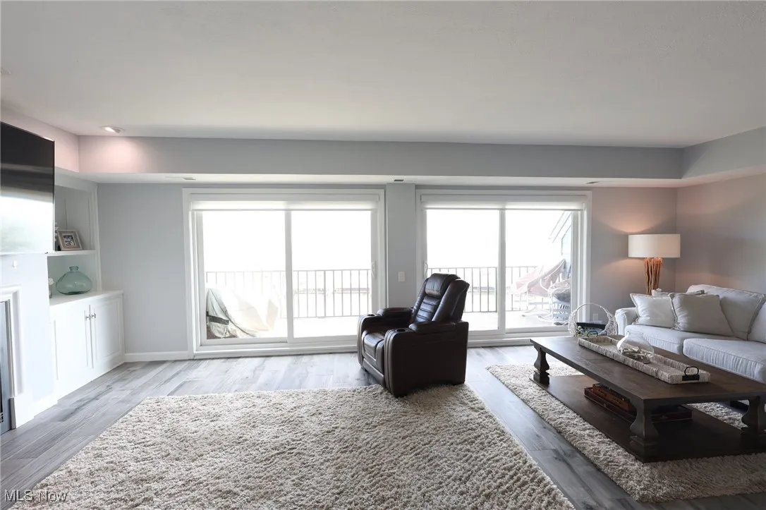 Living room with wood finished floors and baseboards