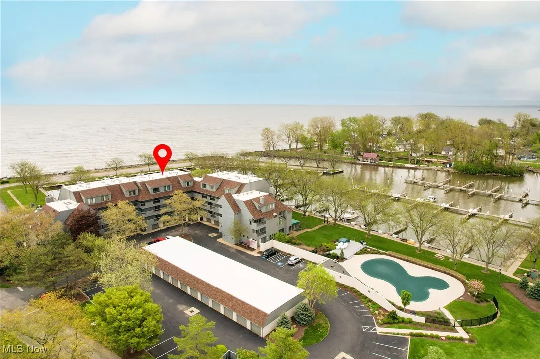 Aerial view of a nearby body of water and a pool