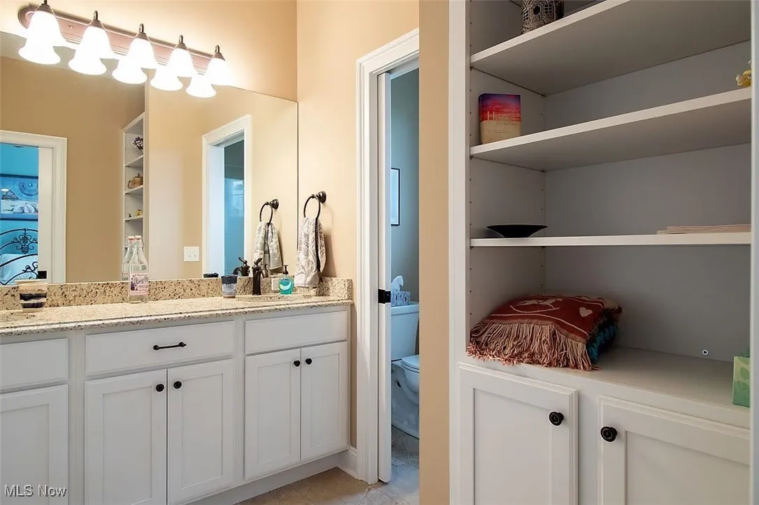 Virtually staged Jack & Jill Bathroom featuring tub/shower & large vanity