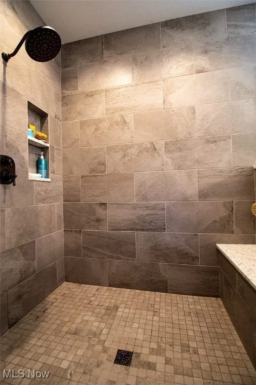Virtually staged Master Bathroom featuring a custom tile shower