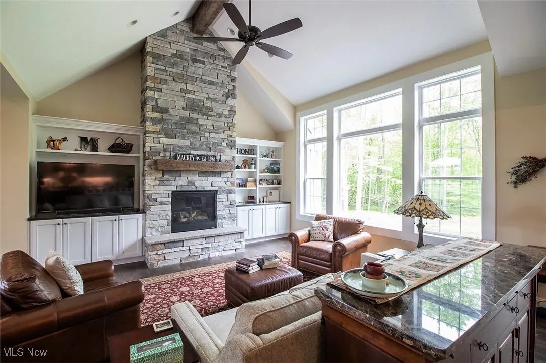 Virtually staged Great room with a wealth of natural light, high vaulted ceiling, optional floor to ceiling stone fireplace